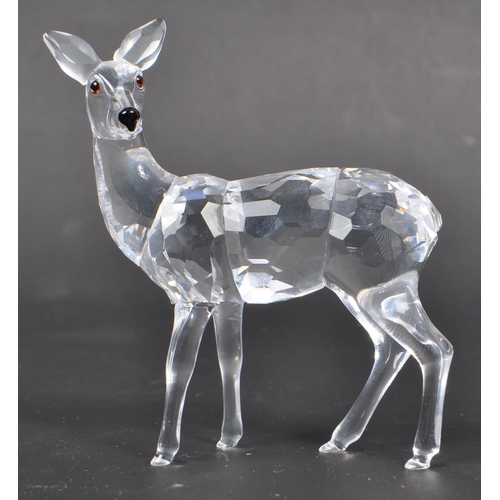 118 - Swarovski - Two Swarovski crystal animal figure ornaments. The collection consisting of two deer fig... 