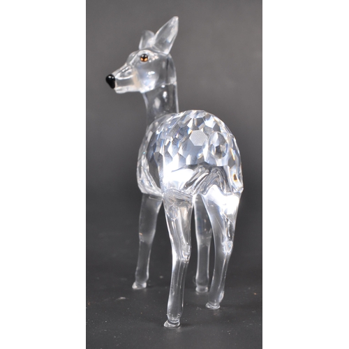 118 - Swarovski - Two Swarovski crystal animal figure ornaments. The collection consisting of two deer fig... 