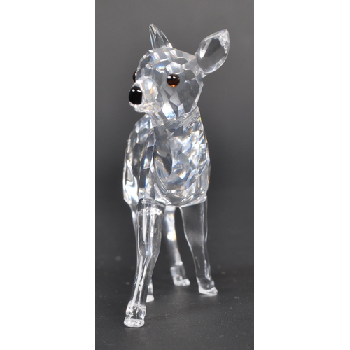 118 - Swarovski - Two Swarovski crystal animal figure ornaments. The collection consisting of two deer fig... 