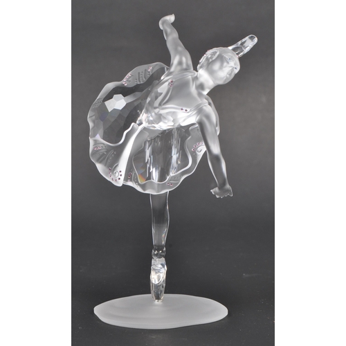 120 - Swarovski - A boxed Swarovski crystal ballerina figure. The figure being posed in a dancing motion, ... 