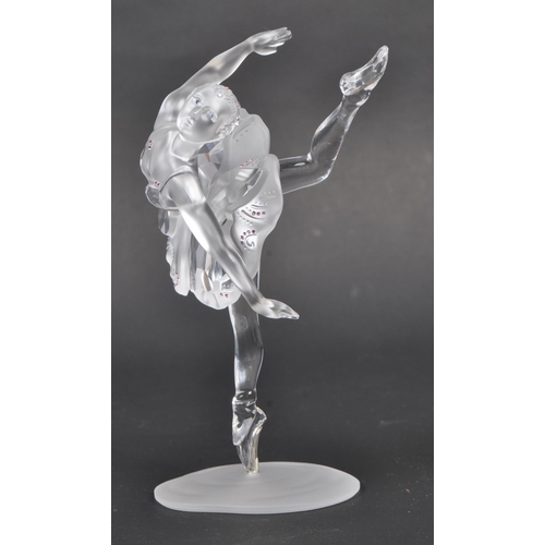 120 - Swarovski - A boxed Swarovski crystal ballerina figure. The figure being posed in a dancing motion, ... 