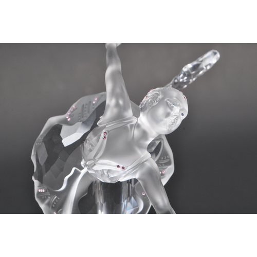 120 - Swarovski - A boxed Swarovski crystal ballerina figure. The figure being posed in a dancing motion, ... 