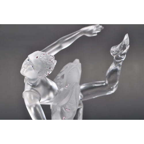 120 - Swarovski - A boxed Swarovski crystal ballerina figure. The figure being posed in a dancing motion, ... 