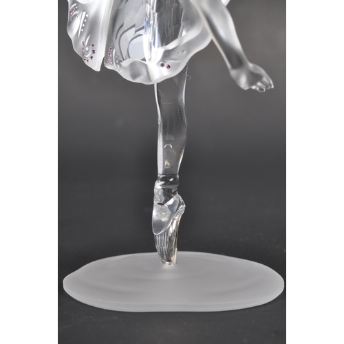 120 - Swarovski - A boxed Swarovski crystal ballerina figure. The figure being posed in a dancing motion, ... 