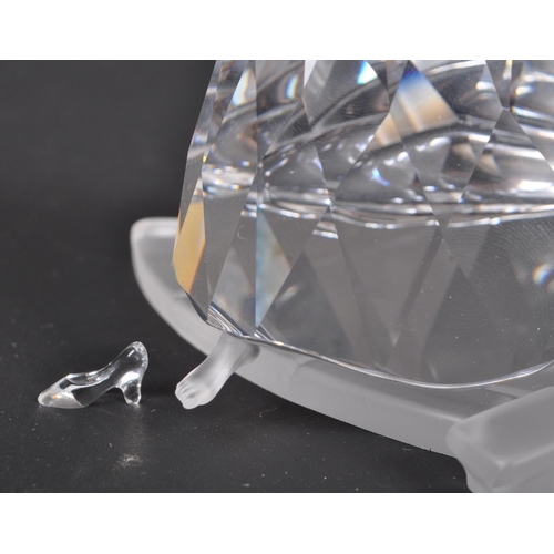 121 - Swarovski - A boxed Swarovski crystal Cinderella with slipper figure. The figure being posed mid ste... 