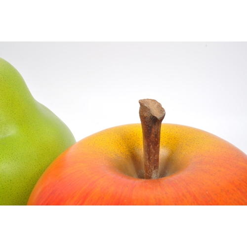 122 - Two large oversized fruit ceramic sculptures in the manner of Selma Calheira. The decorative ceramic... 