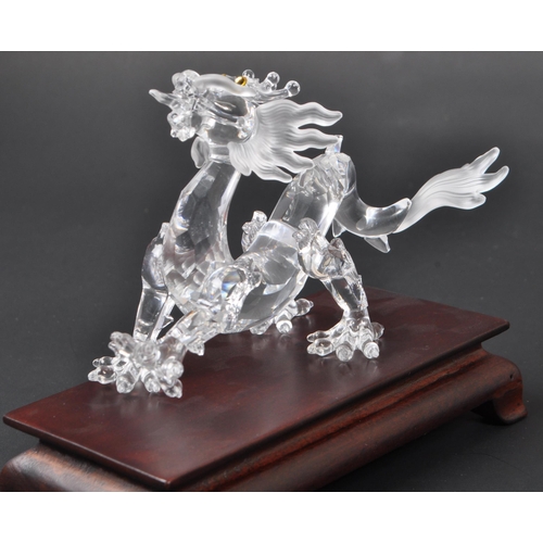 128 - Swarovski - A boxed Swarovski 'Fables and Tales' collection Crystal Zodiacs decorative dragon figure... 