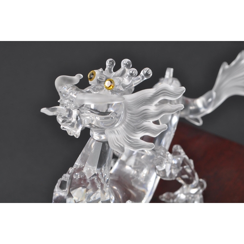 128 - Swarovski - A boxed Swarovski 'Fables and Tales' collection Crystal Zodiacs decorative dragon figure... 