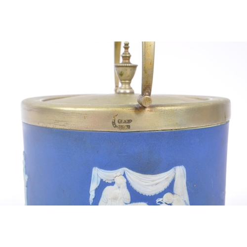 130 - Wedgwood - Jasperware - An early 20th century dark blue biscuit barrel. With a silver plate lid and ... 