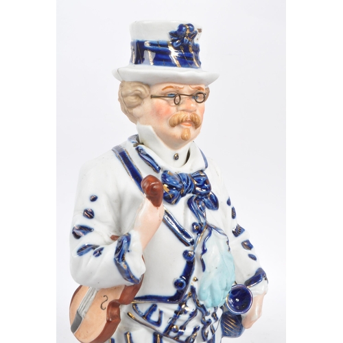 140 - Two vintage Staffordshire ceramic figures in the form of Victorian dressed men carrying instruments ... 