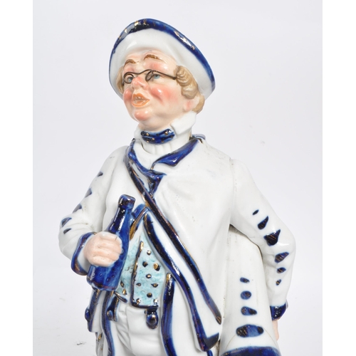 140 - Two vintage Staffordshire ceramic figures in the form of Victorian dressed men carrying instruments ... 