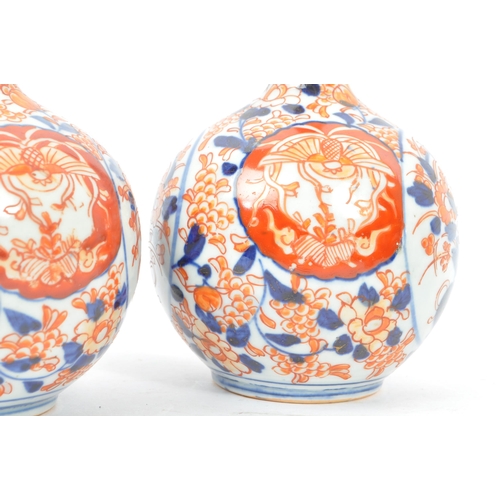 145 - A collection of five Japanese porcelain vase to include a pair of satsuma pottery vases having white... 