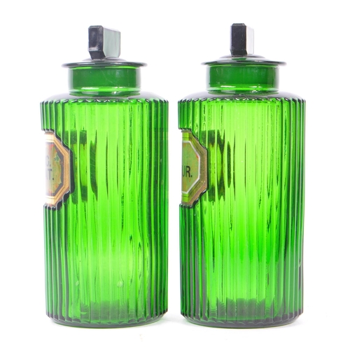 146 - A pair of 20th Century green glass Apothecary chemist poison bottles of circular form with ribbed ef... 