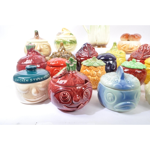 150 - Sylvac - A large collection of twenty one ceramic vegetable and sauces ' Face Pots ' by Sylvac to in... 