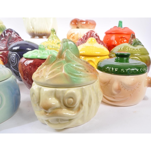 150 - Sylvac - A large collection of twenty one ceramic vegetable and sauces ' Face Pots ' by Sylvac to in... 