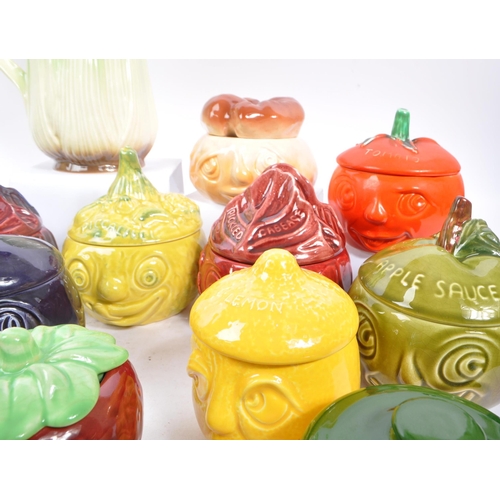 150 - Sylvac - A large collection of twenty one ceramic vegetable and sauces ' Face Pots ' by Sylvac to in... 