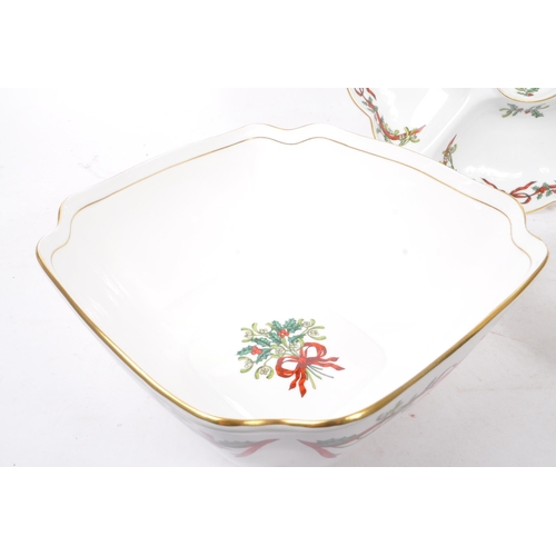 154 - Royal Worcester - A collection of three bone china Royal Worcester pieces in the ' Holly Ribbons ' p... 