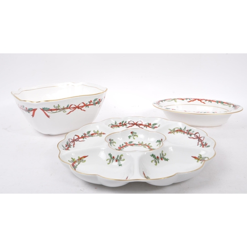 154 - Royal Worcester - A collection of three bone china Royal Worcester pieces in the ' Holly Ribbons ' p... 