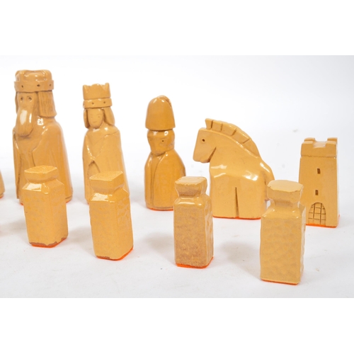 161 - A ceramic handmade terracotta and stoneware colouring chess set with glazed finish and orange felt t... 