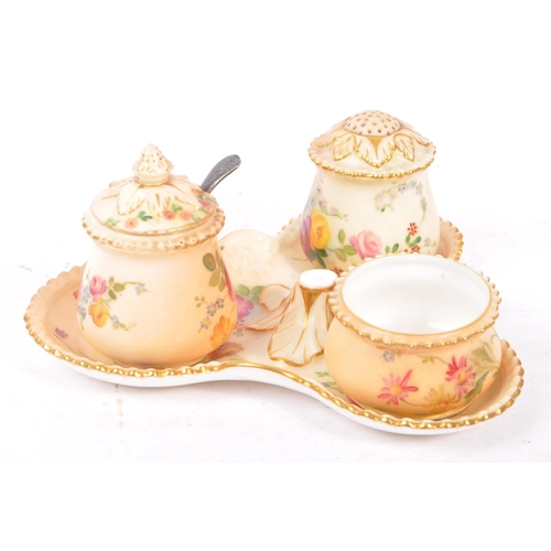 166 - Royal Worcester - Ivory blush cruet set having three condiments on trefoil stand. Handle AF.