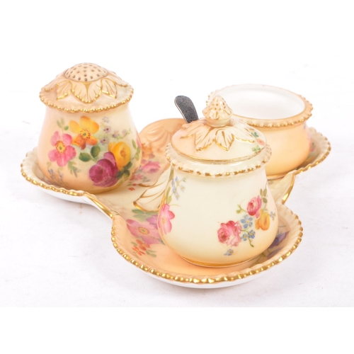 166 - Royal Worcester - Ivory blush cruet set having three condiments on trefoil stand. Handle AF.