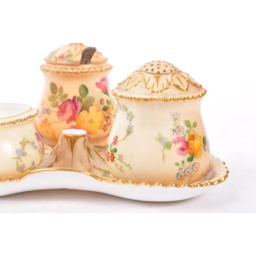 166 - Royal Worcester - Ivory blush cruet set having three condiments on trefoil stand. Handle AF.