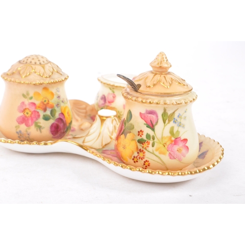 166 - Royal Worcester - Ivory blush cruet set having three condiments on trefoil stand. Handle AF.