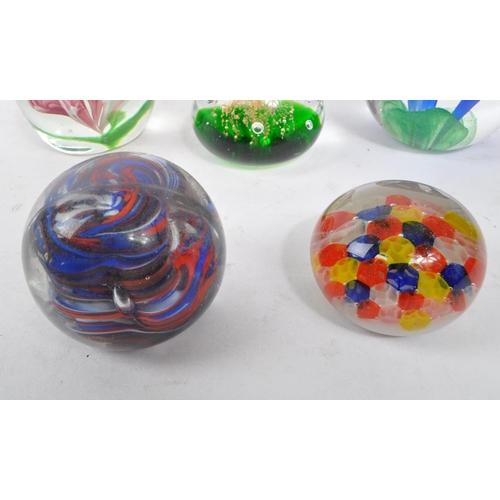 177 - A collection of five vintage 20th century glass paperweights. The paperweights to include millefiori... 