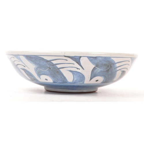 194 - Pat Birks (contemporary) - A pottery ceramic hand painted fruit bowl. In blue and white tones with g... 