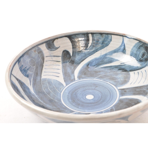 194 - Pat Birks (contemporary) - A pottery ceramic hand painted fruit bowl. In blue and white tones with g... 