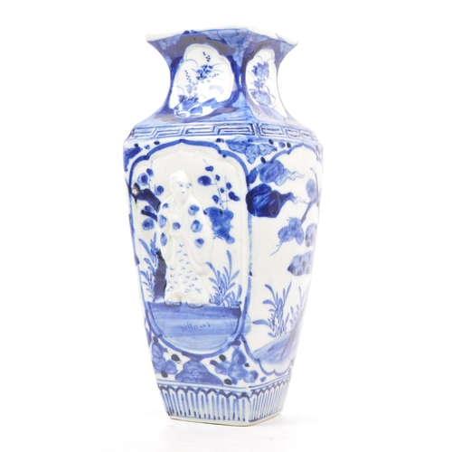 196 - A Japanese early 20th century porcelain china blue and white vase. With a square form tapering body ... 