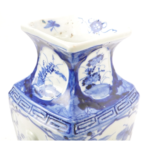 196 - A Japanese early 20th century porcelain china blue and white vase. With a square form tapering body ... 