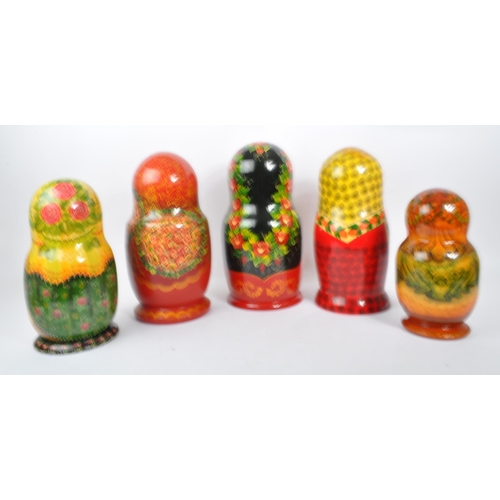 202 - A collection of late 20th century and later Russian USSR folk art Matryoshka graduating nest of doll... 