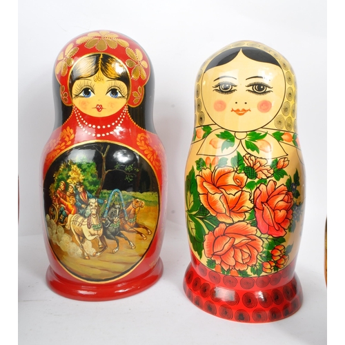 202 - A collection of late 20th century and later Russian USSR folk art Matryoshka graduating nest of doll... 