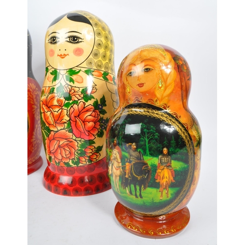 202 - A collection of late 20th century and later Russian USSR folk art Matryoshka graduating nest of doll... 