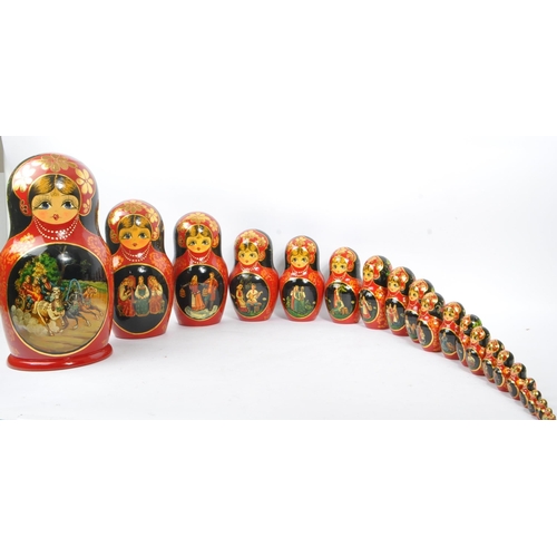 202 - A collection of late 20th century and later Russian USSR folk art Matryoshka graduating nest of doll... 