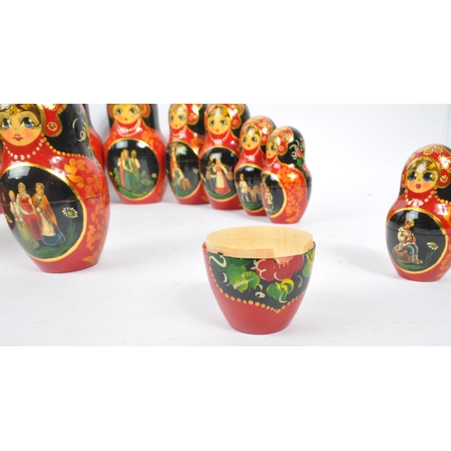 202 - A collection of late 20th century and later Russian USSR folk art Matryoshka graduating nest of doll... 