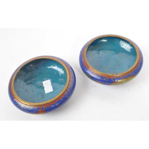 206 - Two small circular squat 1920s Chinese enamel cloisonne trinket owls / dishes of dark blue ground wi... 