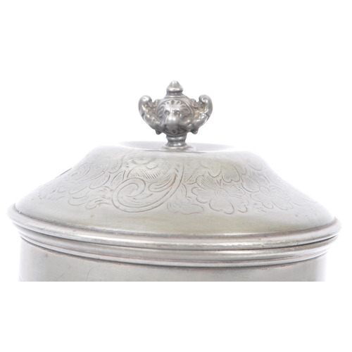 207 - An Anglo-Indian plated circular pewter lidded tea caddy with engraved flourishes and floral pattern,... 