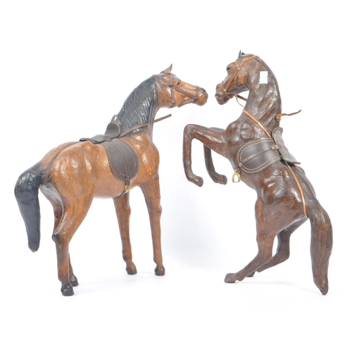 208 - Manner of Liberty & Co - Two 20th Century vintage large brown leather horse models in the style of L... 