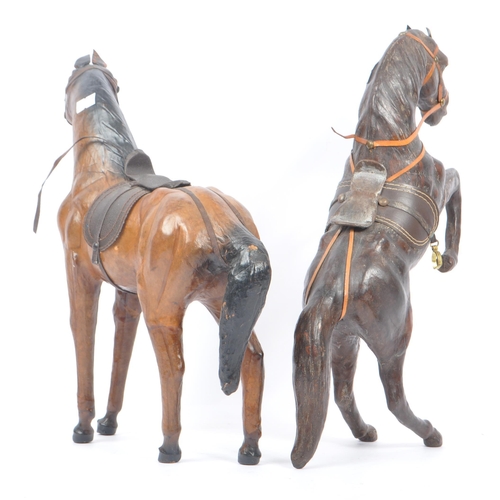 208 - Manner of Liberty & Co - Two 20th Century vintage large brown leather horse models in the style of L... 