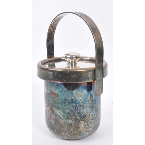 209 - A late 20th century Italian white metal silver plate ice bucket. Having an arched carry handle with ... 