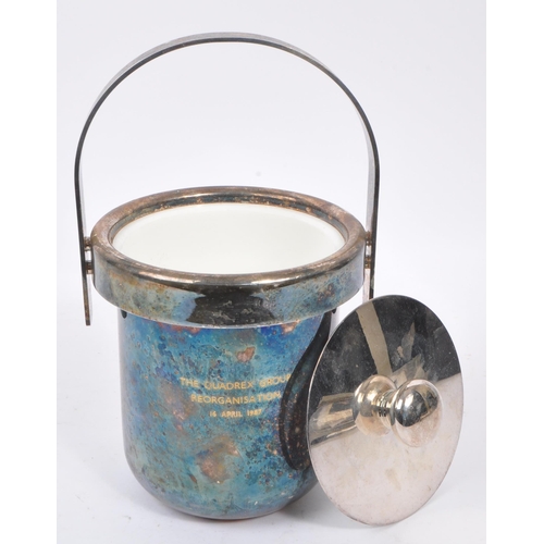 209 - A late 20th century Italian white metal silver plate ice bucket. Having an arched carry handle with ... 