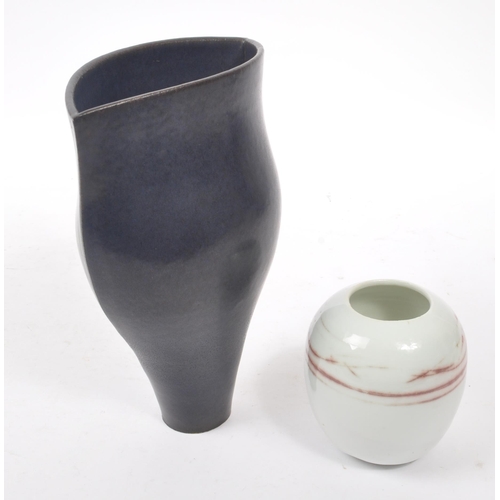 21 - Laurence Rye - A 20th Century studio pottery vase by Laurence Rye, dark blue ground of tapered asymm... 