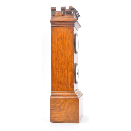 210 - An early 20th century oak mantel clock barometer. The clock sat on a plinth base, stepped to top, be... 