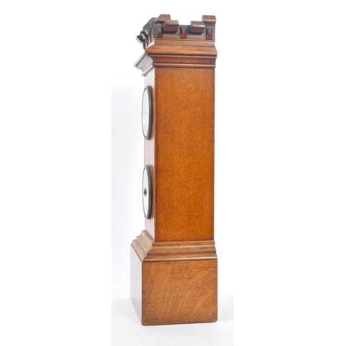 210 - An early 20th century oak mantel clock barometer. The clock sat on a plinth base, stepped to top, be... 