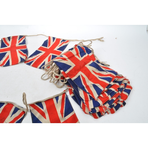 226 - A string of 20th century circa 1940s British Union Jack flag bunting. Each piece in small lettering ... 