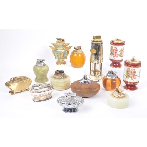 228 - A large collection of 20th century table lighters. The collection to include a variety of examples, ... 