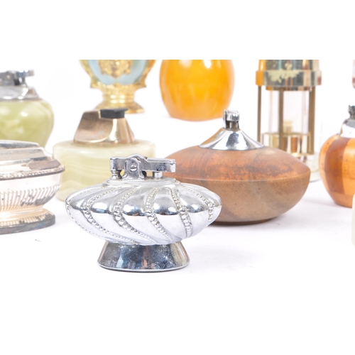 228 - A large collection of 20th century table lighters. The collection to include a variety of examples, ... 