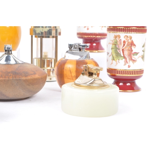 228 - A large collection of 20th century table lighters. The collection to include a variety of examples, ... 